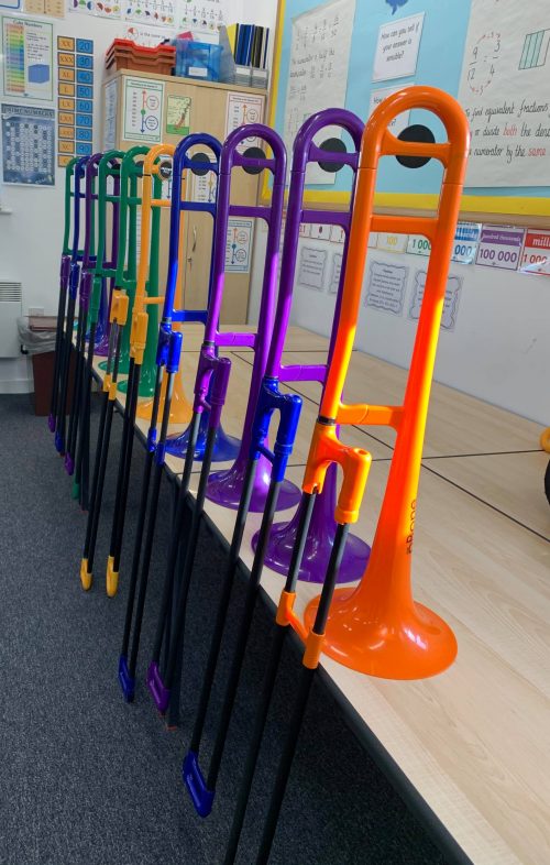 Pbones of different colours stacked in a classroom